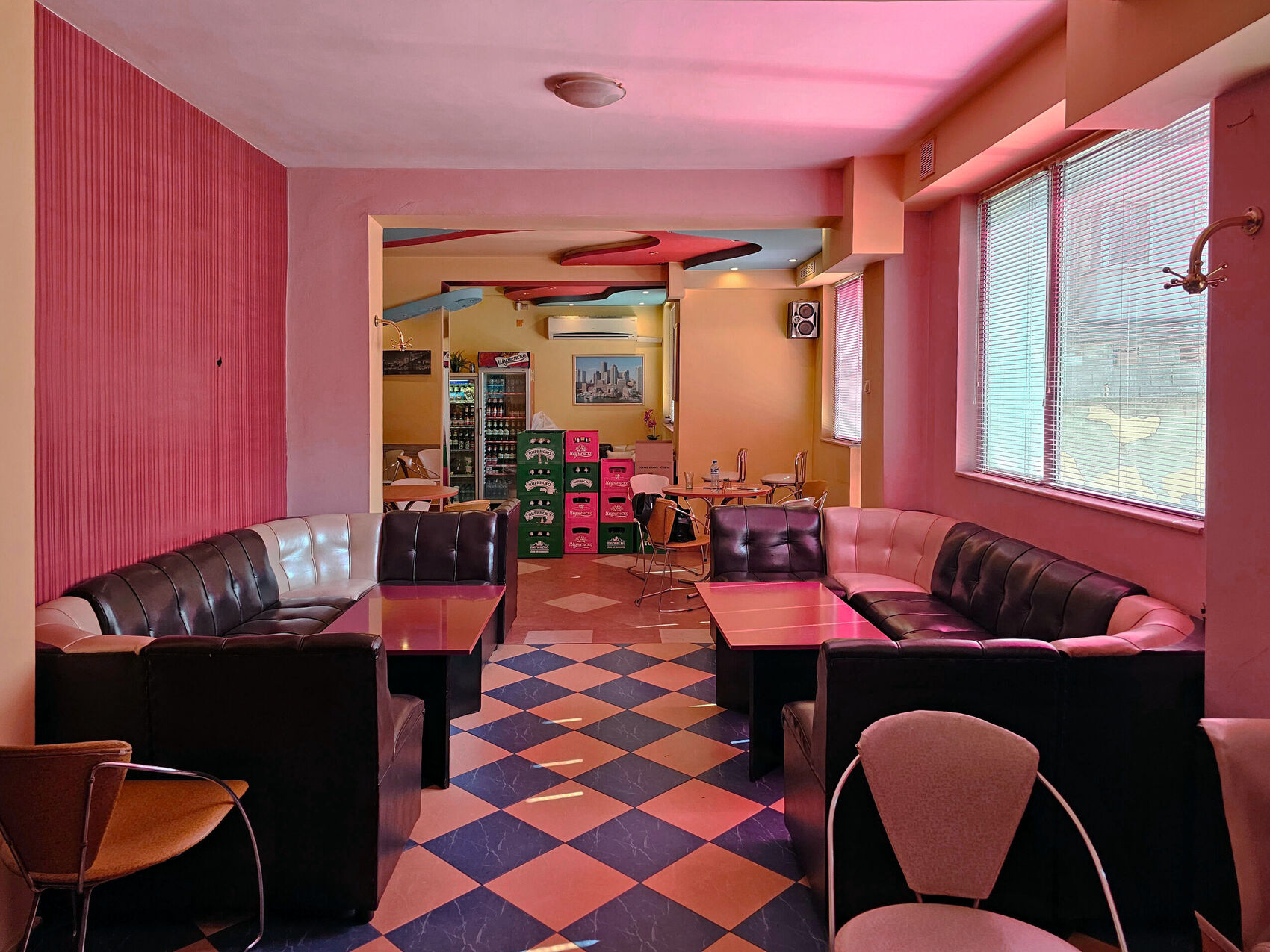 The dining room before, looking through to the opening and drink crates.