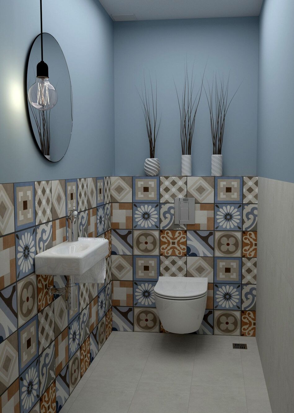 Guest WC with blue walls, patterned tiles and a round mirror.