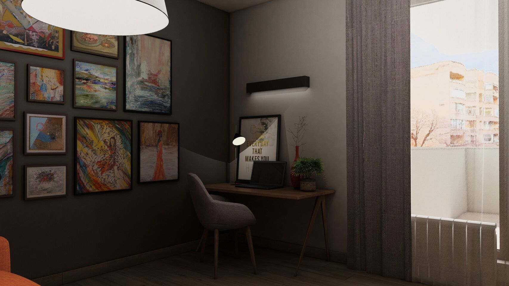 Le bureau près des tableaux et de la fenêtre.