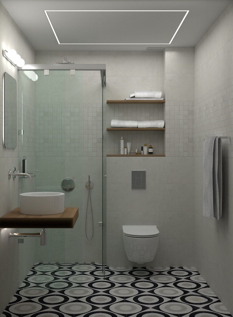La ducha, el lavabo sobre estante de madera y los estantes empotrados.