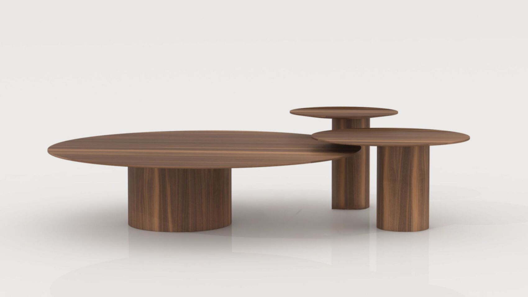 Sunflower Tables Collection: три кръгли орехови маси с различна височина.