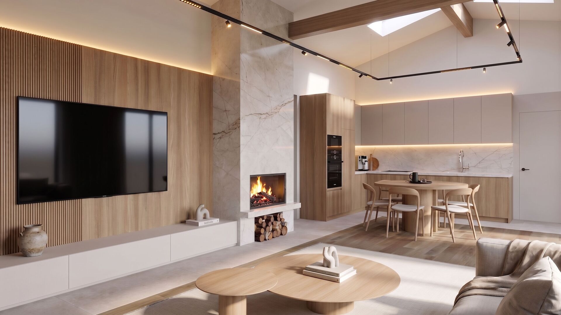 Maison à Bezden : un volume ouvert de séjour et cuisine, bois, marbre et cheminée sous un toit pentu.