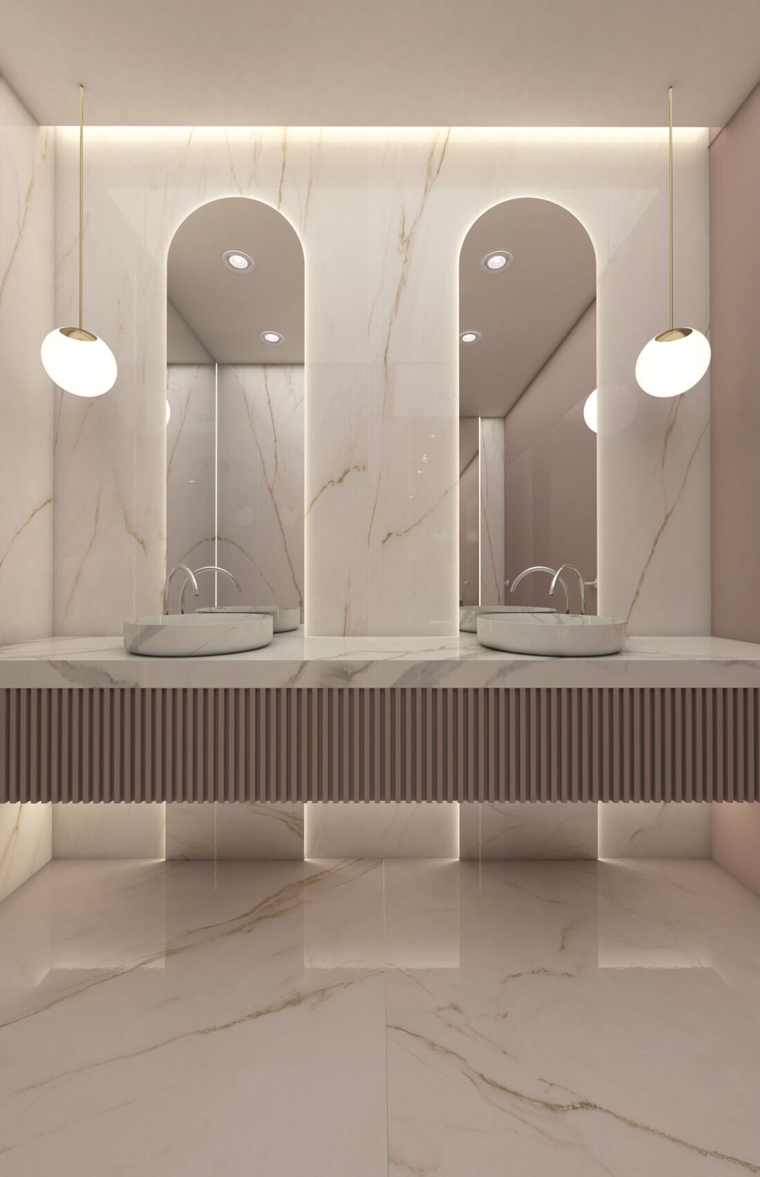 Deux vasques sous des miroirs en arc.