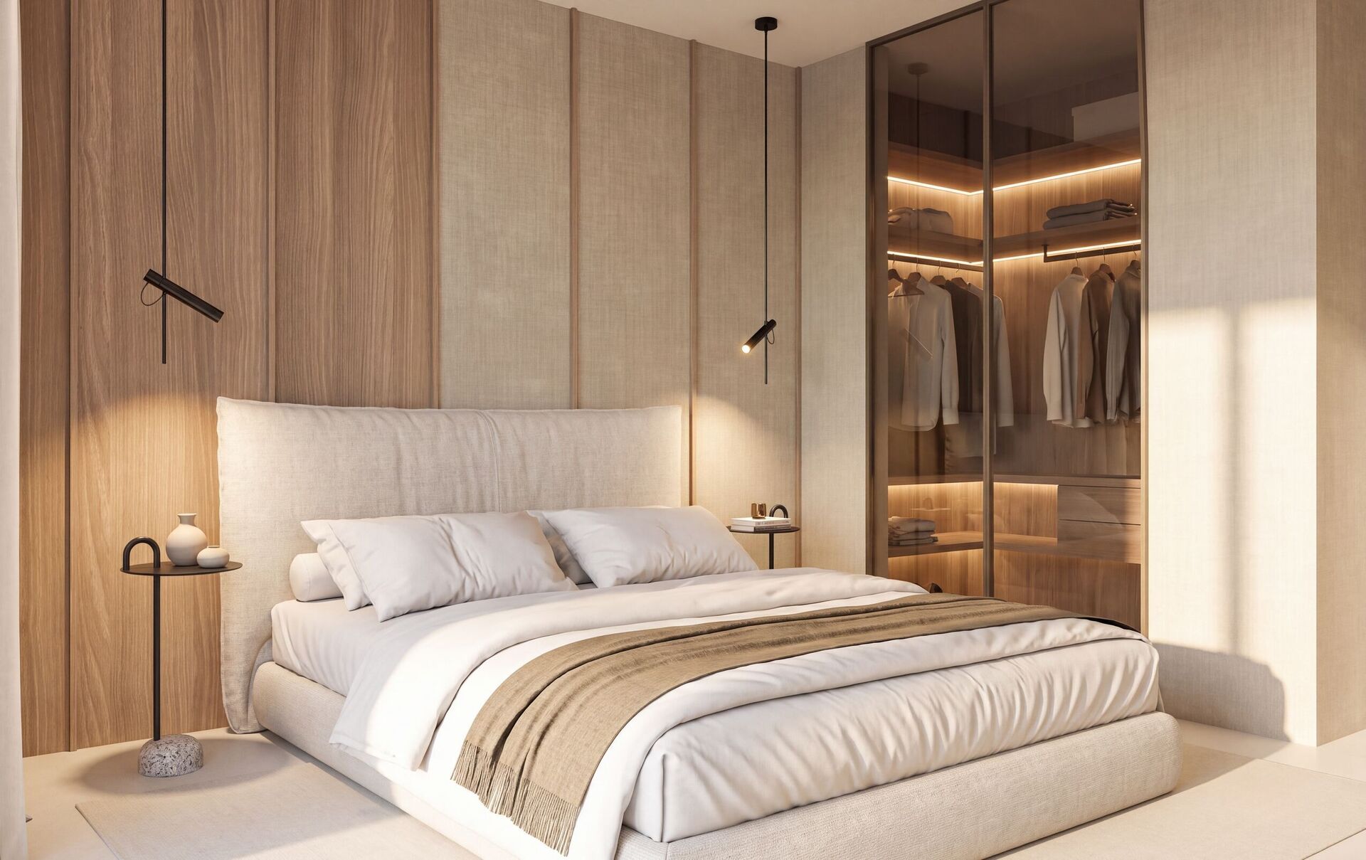 Le lit vers le dressing vitré et ses tablettes éclairées.