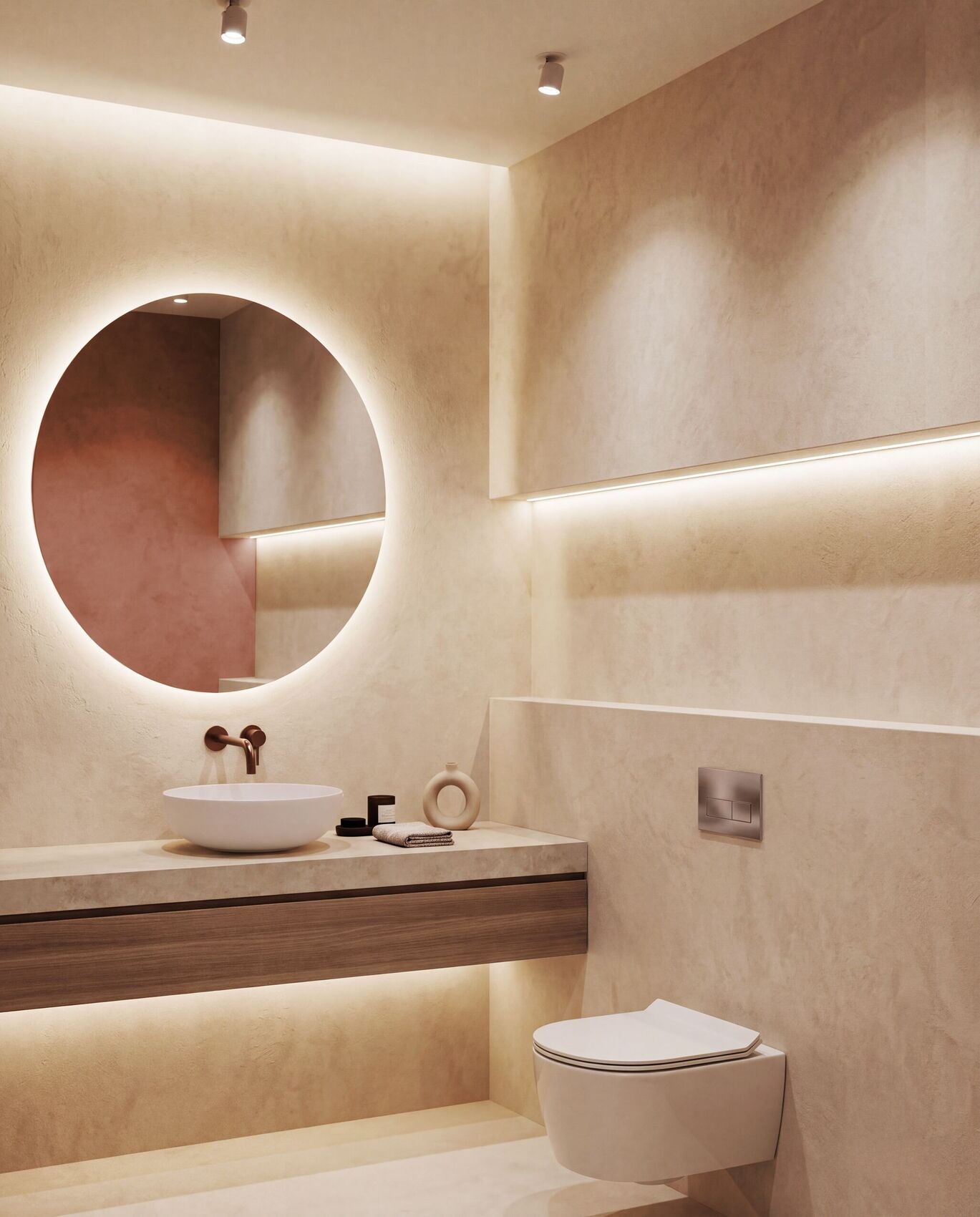 Le meuble vasque et le miroir rond rétroéclairé.